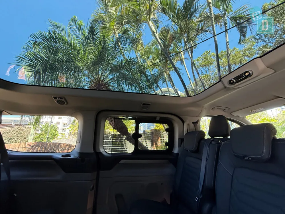 Panoramic glass roof view inside the Ford Tourneo cabin