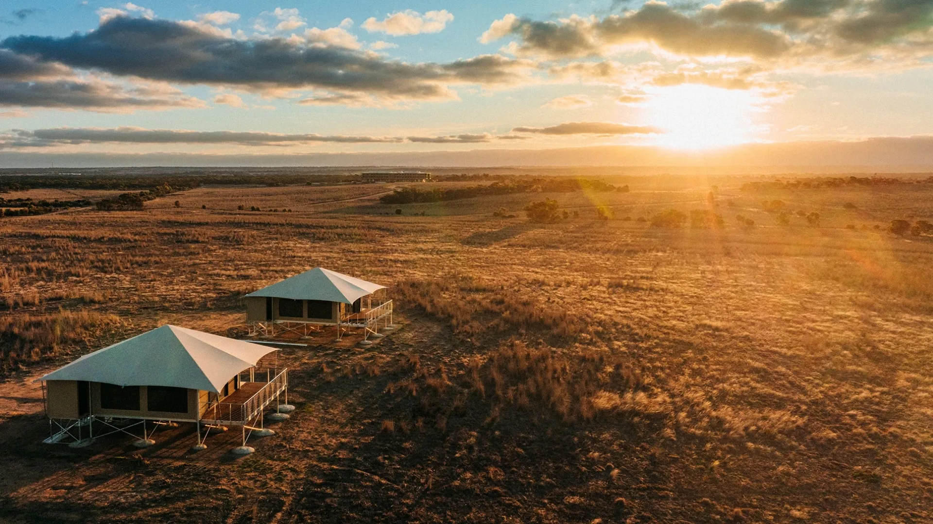 Aerial view of Monarto Safari Lodge tented suites at sunrise